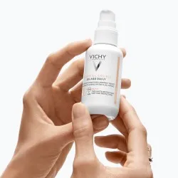 Fluid colorat SPF50+ cu actiune impotriva foto-imbatranirii tenului, nuanta deschisa-medie, Vichy